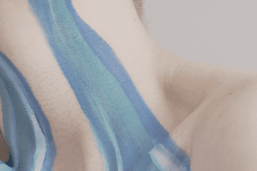 An abstract crop of a river of painted tears running down a woman's face.